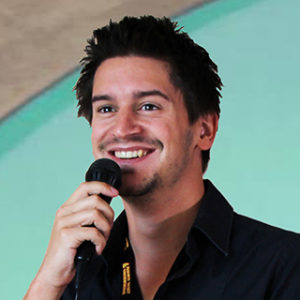 Aaron Sustar speaking at an event